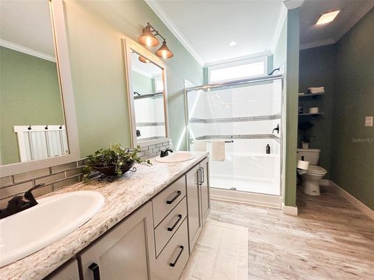 Bathroom, Dual Sink Vanities, Glass Shower, Interior, Recessed Lighting, Wood Texture Flooring