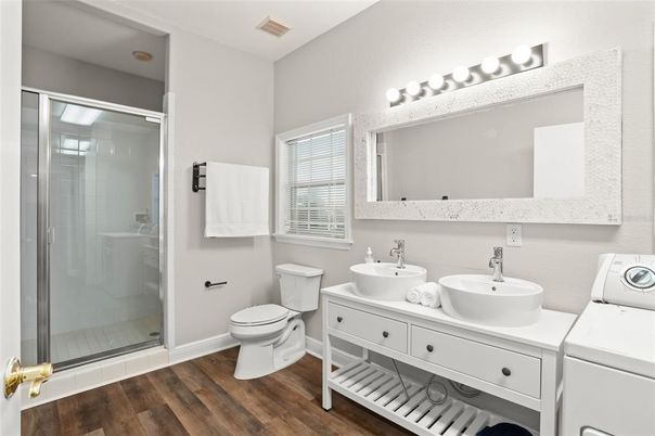Bathroom, Dual Sink Vanities, Glass Shower, Interior, Wood Texture Flooring