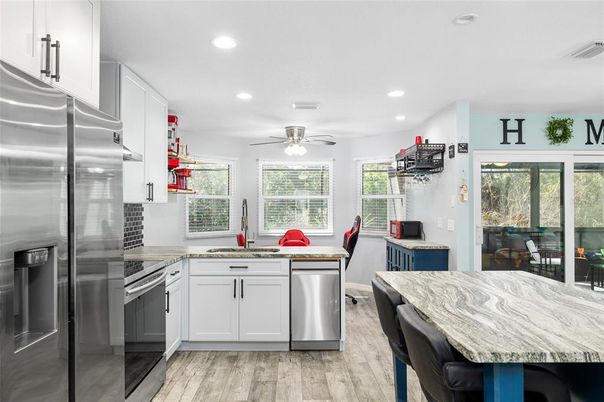Dining room, Interior, Kitchen, Recessed Lighting, Stainless Steel Appliances, Wood Texture Flooring