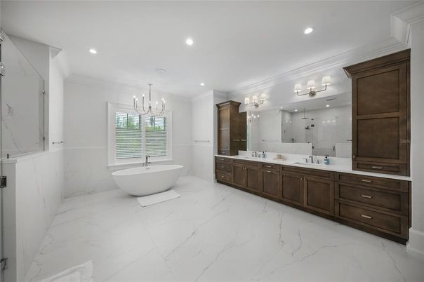 Bathroom, Chandelier, Dual Sink Vanities, Free Standing Baths, Interior, Marble, Marble Walls, Recessed Lighting