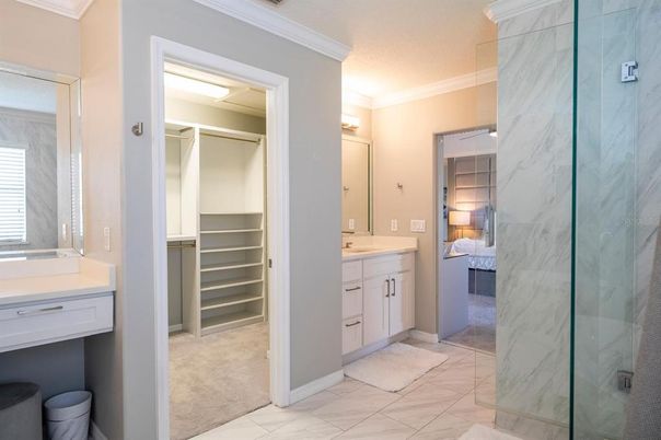 Bathroom, Dual Sink Vanities, Glass Shower, Interior, Marble, Marble Walls, Walk-in Closets