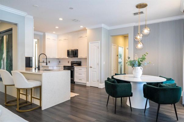 Dining room, Interior, Kitchen, Pendant Lights, Recessed Lighting, Stainless Steel Appliances, Wood Texture Flooring