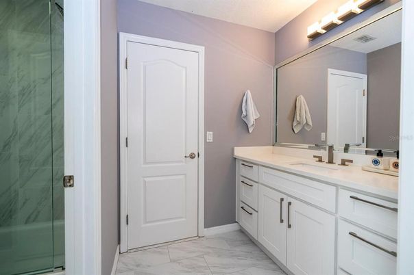 Bathroom, Dual Sink Vanities, Glass Shower, Interior, Marble, Marble Walls