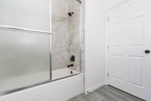Bathroom, Glass Shower, Interior, Marble Walls, Wood Texture Flooring