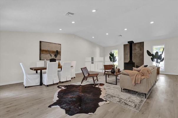 Dining room, Fireplace, Interior, Living room, Recessed Lighting, Wood Texture Flooring