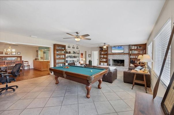 Billiard Table, Chandelier, Fireplace, Game Room, Interior, Pendant Lights, Wood Texture Flooring
