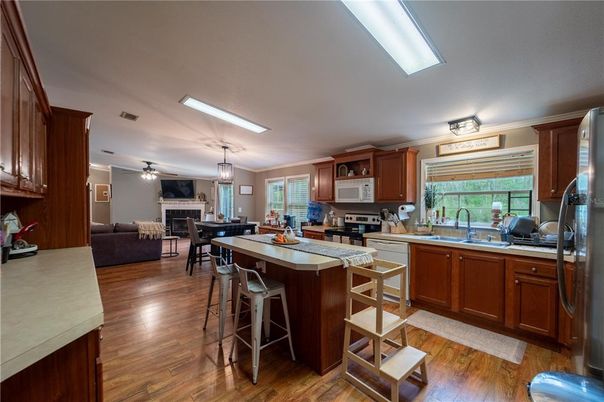 Dining room, Interior, Kitchen, Living room, Pendant Lights, Stainless Steel Appliances, Wood Texture Flooring