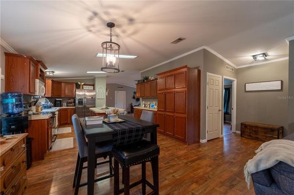 Dining room, Interior, Kitchen, Pendant Lights, Stainless Steel Appliances, Wood Texture Flooring