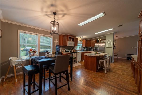 Dining room, Interior, Kitchen, Pendant Lights, Stainless Steel Appliances, Wood Texture Flooring