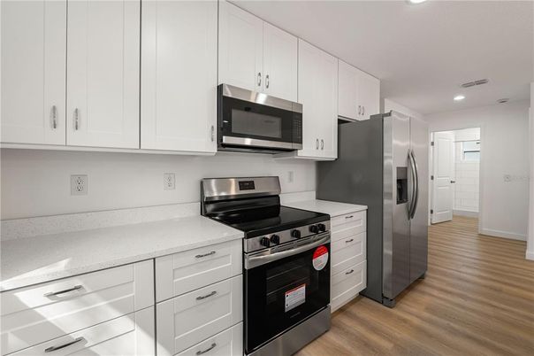 Interior, Kitchen, Recessed Lighting, Stainless Steel Appliances, Wood Texture Flooring