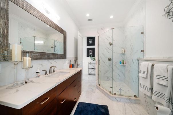 Bathroom, Dual Sink Vanities, Glass Shower, Interior, Marble, Marble Walls, Recessed Lighting