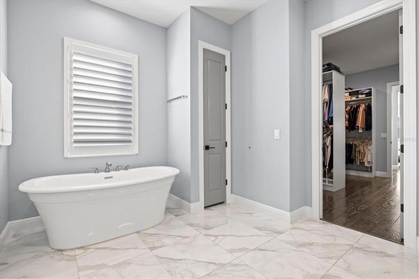 Bathroom, Free Standing Baths, Interior, Marble, Walk-in Closets, Wood Texture Flooring