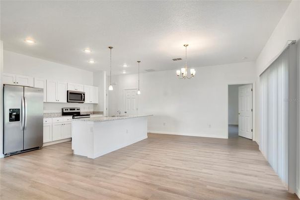 Chandelier, Interior, Kitchen, Pendant Lights, Recessed Lighting, Stainless Steel Appliances, Wood Texture Flooring