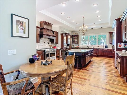 Chandelier, Dining room, Interior, Kitchen, Recessed Lighting, Stainless Steel Appliances, Wood Texture Flooring