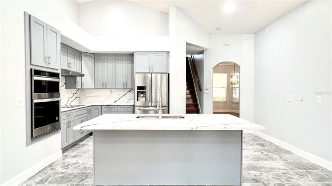 Interior, Kitchen, Marble Walls, Recessed Lighting, Stainless Steel Appliances