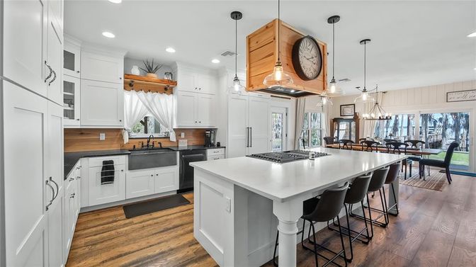 Dining room, Interior, Kitchen, Pendant Lights, Recessed Lighting, Stainless Steel Appliances, Wood Texture Flooring