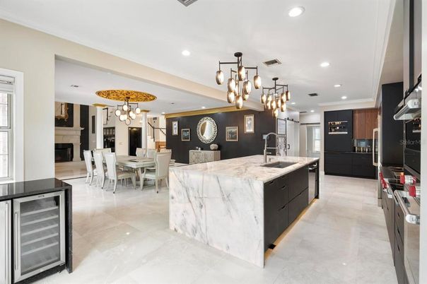 Chandelier, Dining room, Fireplace, Interior, Kitchen, Pendant Lights, Recessed Lighting, Stainless Steel Appliances