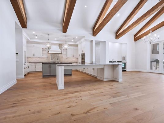 Chandelier, Interior, Kitchen, Pendant Lights, Recessed Lighting, Stainless Steel Appliances, Wooden Beams, Wood Texture Flooring