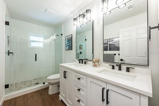 Bathroom, Dual Sink Vanities, Glass Shower, Interior, Wood Texture Flooring
