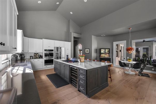 Dining room, Interior, Kitchen, Pendant Lights, Recessed Lighting, Stainless Steel Appliances, Wood Texture Flooring