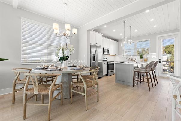 Chandelier, Dining room, Interior, Kitchen, Pendant Lights, Recessed Lighting, Stainless Steel Appliances, Wood Texture Flooring