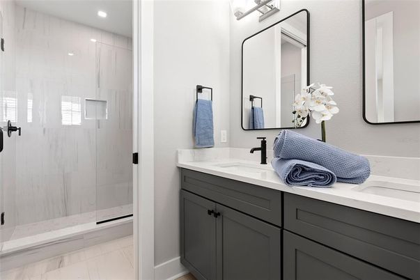 Bathroom, Dual Sink Vanities, Glass Shower, Interior, Marble, Recessed Lighting