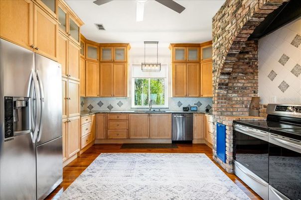 Interior, Kitchen, Pendant Lights, Stainless Steel Appliances, Stone Walls, Wood Texture Flooring