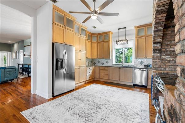 Interior, Kitchen, Pendant Lights, Recessed Lighting, Stainless Steel Appliances, Stone Walls, Wood Texture Flooring