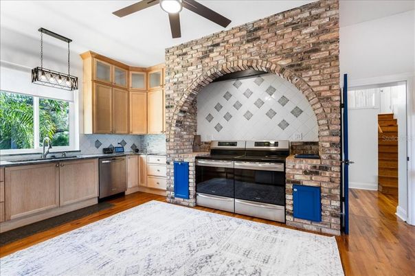 Interior, Kitchen, Pendant Lights, Stainless Steel Appliances, Stone Walls, Wood Texture Flooring