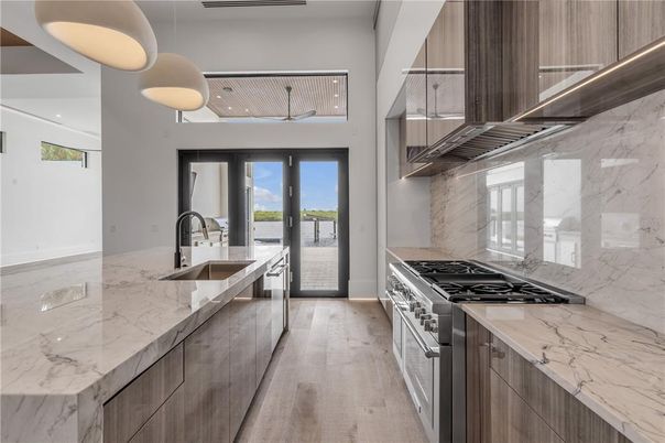 Interior, Kitchen, Marble Walls, Pendant Lights, Stainless Steel Appliances, Water, Wood Texture Flooring