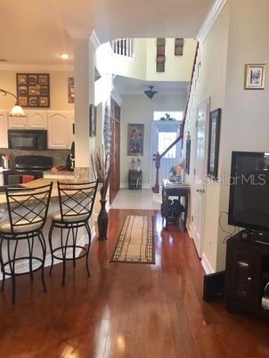 Dining room, Fireplace, Interior, Kitchen, Recessed Lighting, Wood Texture Flooring