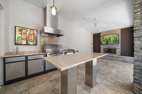 Fireplace, Interior, Kitchen, Pendant Lights, Recessed Lighting, Stainless Steel Appliances, Stone Walls