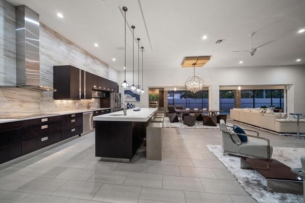 Chandelier, Dining room, Interior, Kitchen, Living room, Pendant Lights, Recessed Lighting, Stainless Steel Appliances