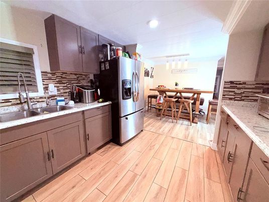 Dining room, Interior, Kitchen, Recessed Lighting, Stainless Steel Appliances, Wood Texture Flooring