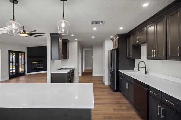 Fireplace, Interior, Kitchen, Pendant Lights, Recessed Lighting, Wood Texture Flooring