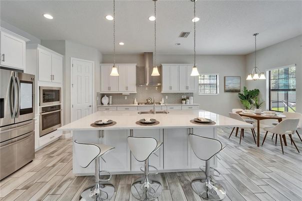Dining room, Interior, Kitchen, Pendant Lights, Recessed Lighting, Stainless Steel Appliances, Wood Texture Flooring