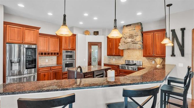 Interior, Kitchen, Pendant Lights, Recessed Lighting, Stainless Steel Appliances, Stone Walls