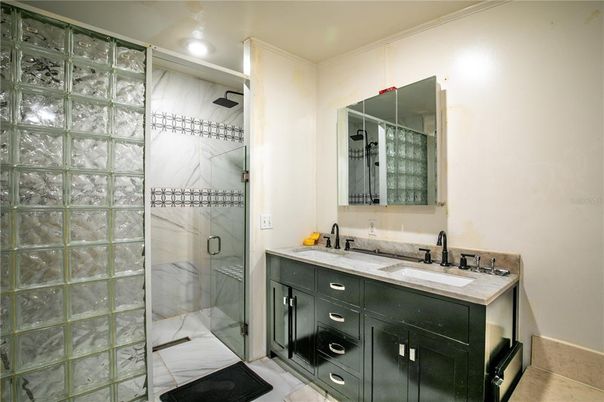 Bathroom, Dual Sink Vanities, Glass Shower, Interior, Marble Walls, Recessed Lighting