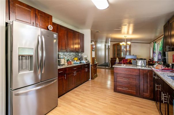 Chandelier, Dining room, Interior, Kitchen, Stainless Steel Appliances, Wood Texture Flooring