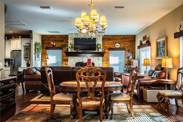 Chandelier, Dining room, Fireplace, Interior, Stone Walls, Wood Texture Flooring, Wooden Walls