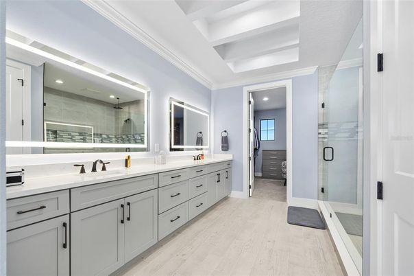 Bathroom, Dual Sink Vanities, Glass Shower, Interior, Recessed Lighting, Wood Texture Flooring