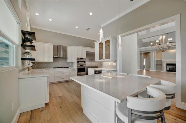 Chandelier, Interior, Kitchen, Pendant Lights, Recessed Lighting, Stainless Steel Appliances, Wood Texture Flooring