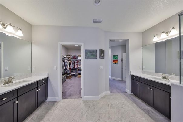 Bathroom, Dual Sink Vanities, Interior, Marble, Recessed Lighting, Walk-in Closets