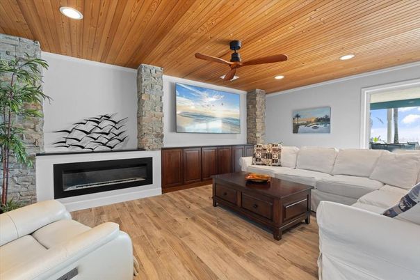 Fireplace, Interior, Living room, Recessed Lighting, Stone Walls, Wooden Ceilings, Wood Texture Flooring
