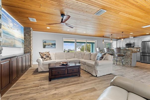 Dining room, Interior, Kitchen, Living room, Pendant Lights, Recessed Lighting, Stainless Steel Appliances, Wooden Ceilings, Wood Texture Flooring