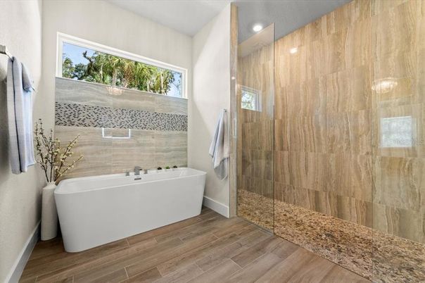 Bathroom, Free Standing Baths, Glass Shower, Interior, Recessed Lighting, Wood Texture Flooring