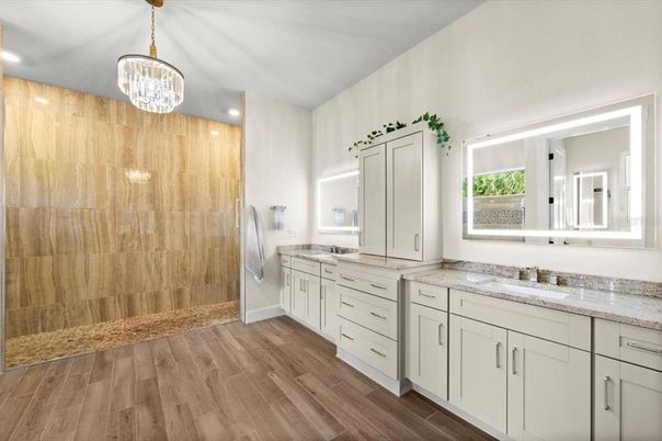 Bathroom, Chandelier, Dual Sink Vanities, Interior, Recessed Lighting, Wood Texture Flooring