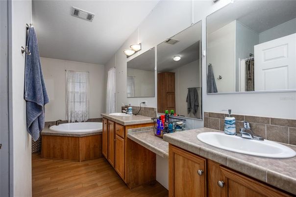 Bathroom, Dual Sink Vanities, Interior, Tile Countertops, Wood Texture Flooring