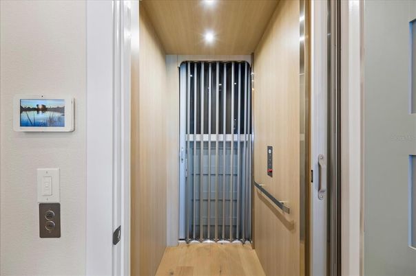Elevator, Interior, Recessed Lighting, Wood Texture Flooring, Wooden Walls