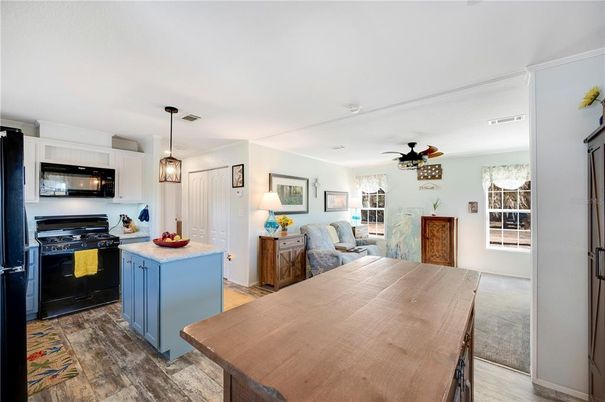Dining room, Interior, Kitchen, Pendant Lights, Stainless Steel Appliances, Wood Texture Flooring